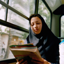 Woman Reading on Bus, Tehran, Iran / 2006